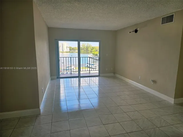 a kitchen with stainless steel appliances a stove microwave and sink