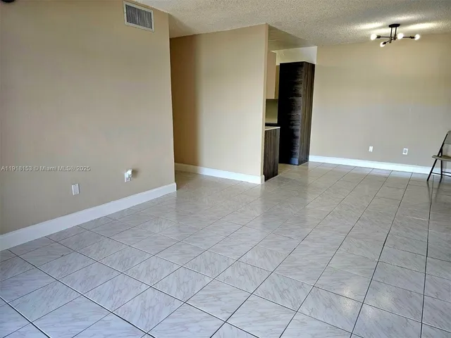 a kitchen with stainless steel appliances a refrigerator and a stove