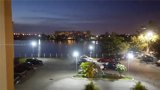 a view of a street with cars parked