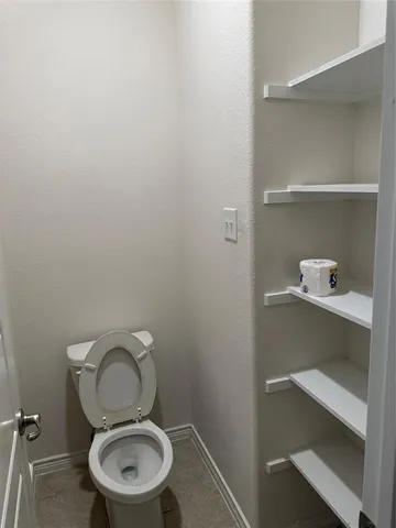 a bathroom with a toilet and a sink