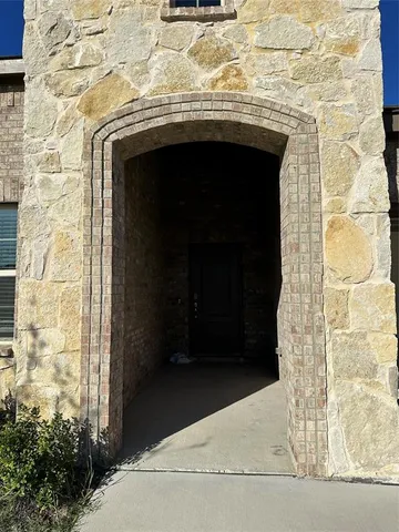 a brick house with a door