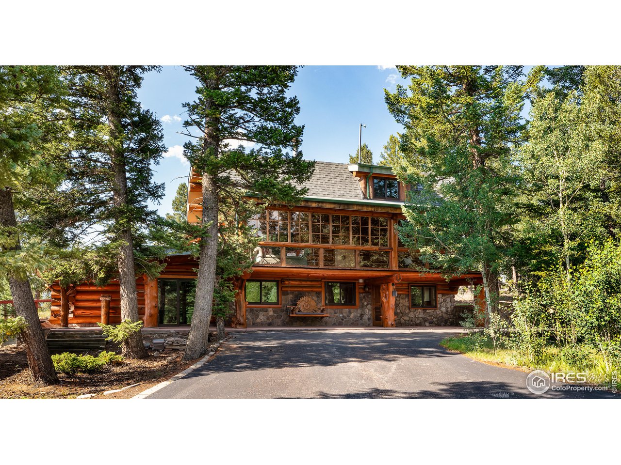 625 North Beaver Road Black Hawk, CO 80422 - Photo 1 of 40 a front view of a house with a garden