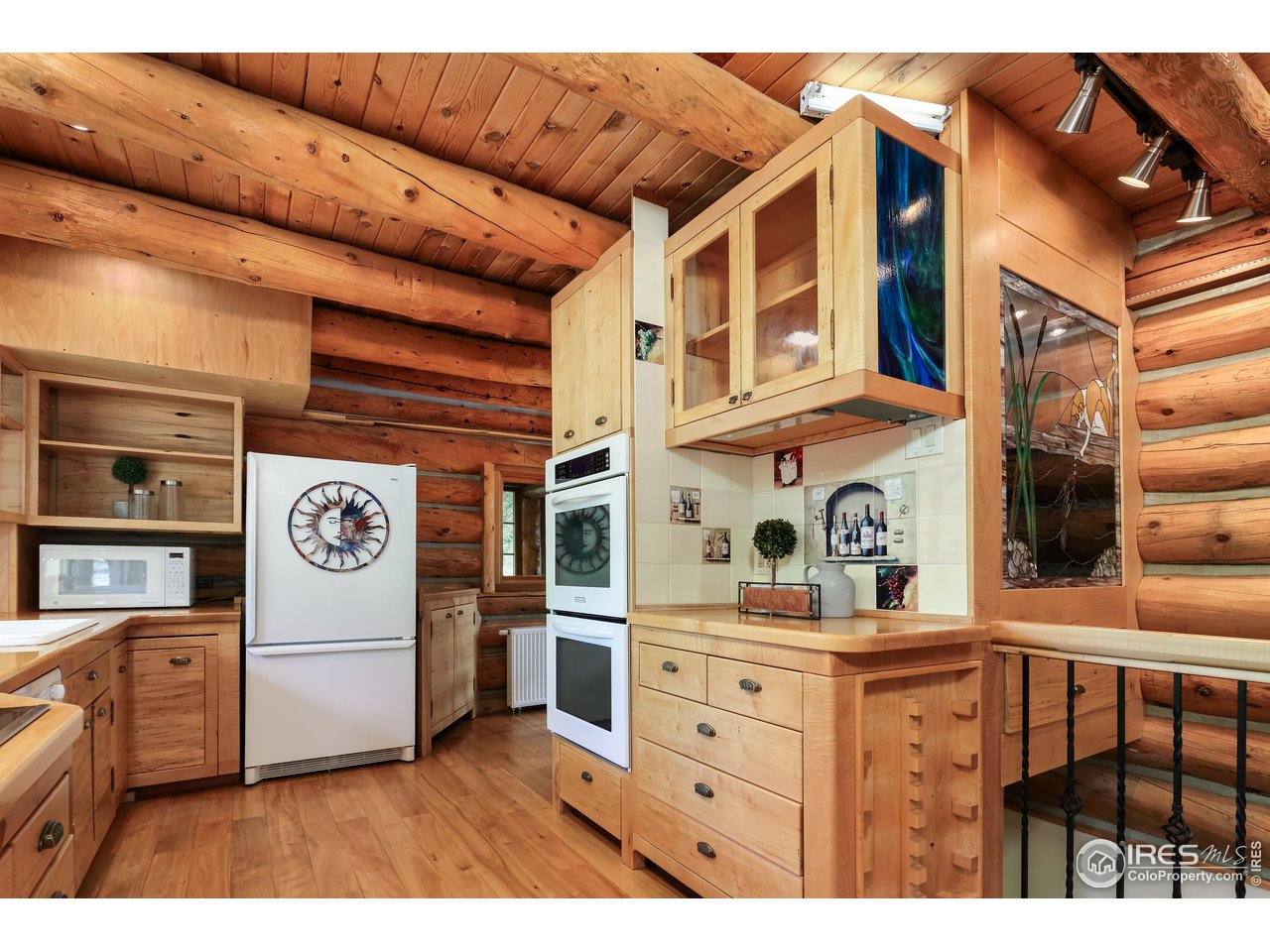 625 North Beaver Road Black Hawk, CO 80422 - Photo 14 of 40 a view of kitchen with cabinets and wooden floor