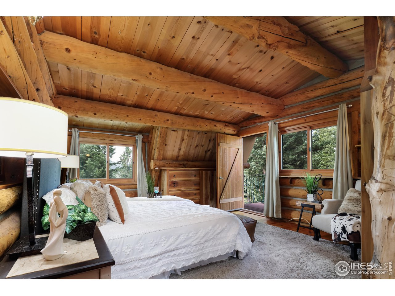 625 North Beaver Road Black Hawk, CO 80422 - Photo 22 of 40 a bed room with furniture and a large window