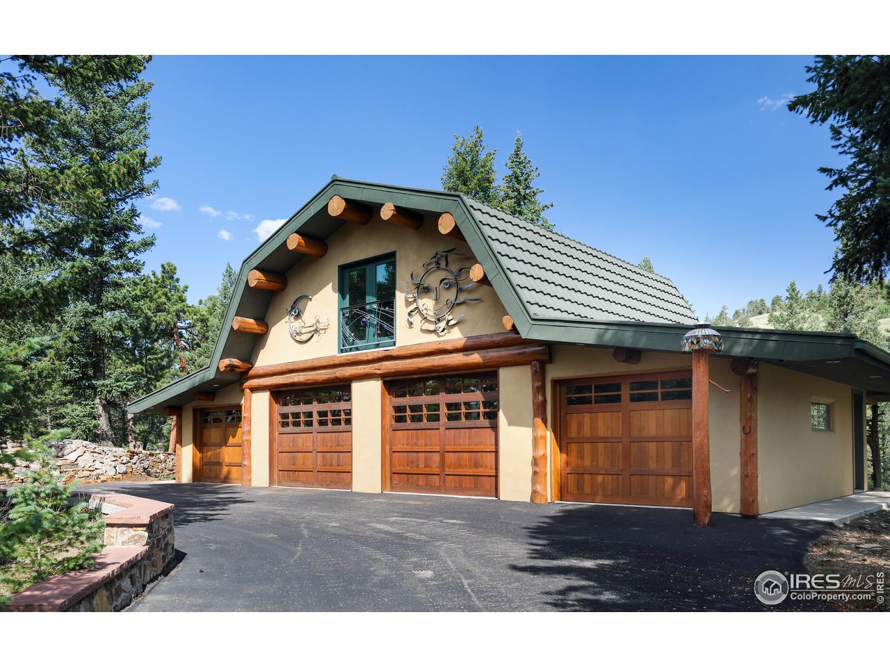 625 North Beaver Road Black Hawk, CO 80422 - Photo 3 of 40 a front view of a house with a yard