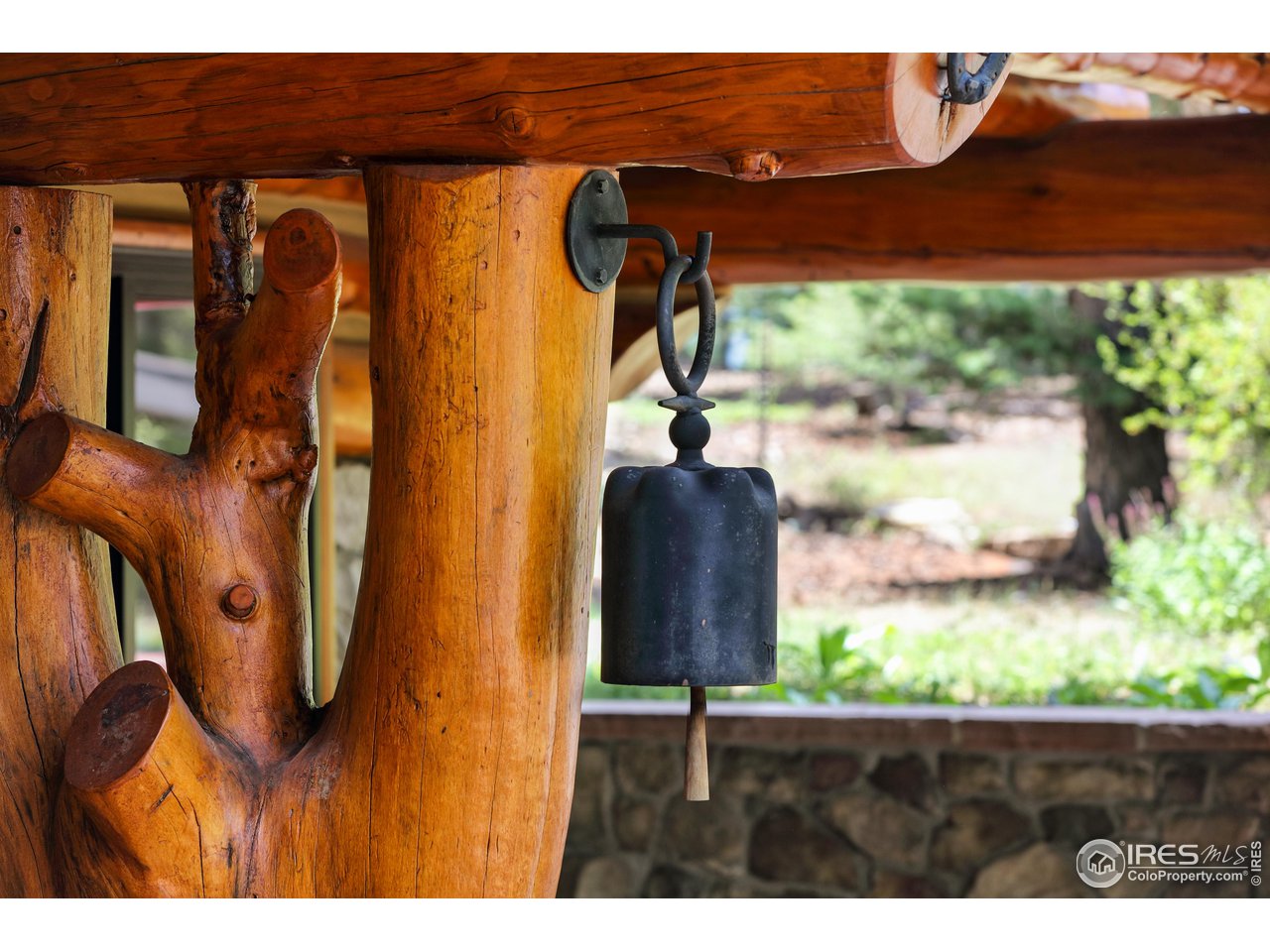 625 North Beaver Road Black Hawk, CO 80422 - Photo 31 of 40 a view of a porch with a floor to ceiling window and tree