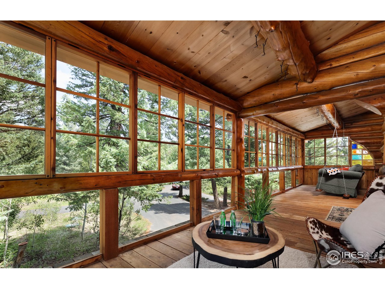 625 North Beaver Road Black Hawk, CO 80422 - Photo 4 of 40 a view of a porch with furniture and a yard