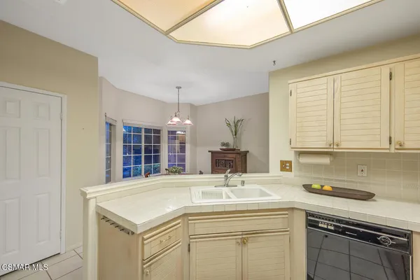 a bathroom with a sink and a window