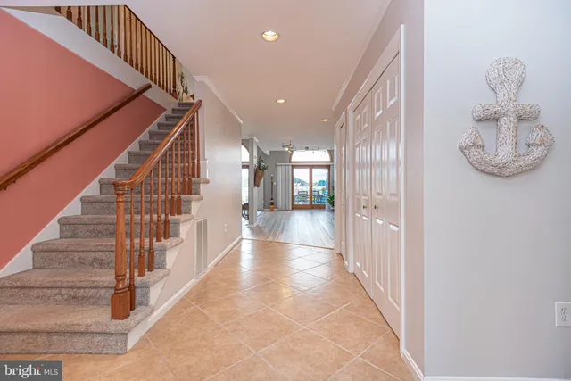 a kitchen with stainless steel appliances granite countertop wooden floors and granite counter tops