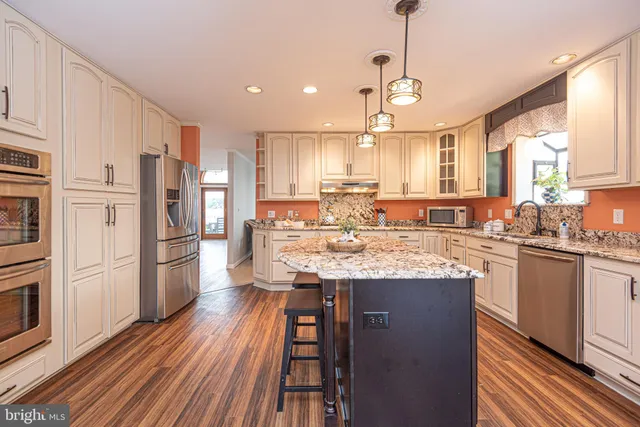a bathroom with a tub a sink and a shower