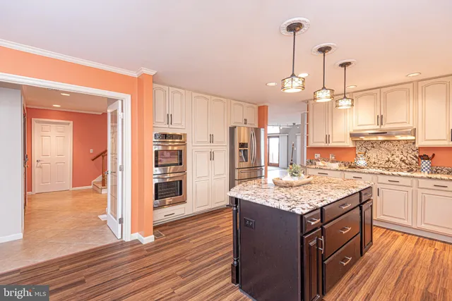 a bedroom with two beds and a large window
