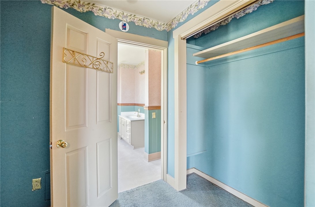 1444 Eagle City Road Springfield, OH 45504 - Photo 35 of 50 A well-appointed closet offers convenience and organization, flowing into an adjacent bright bathroom.