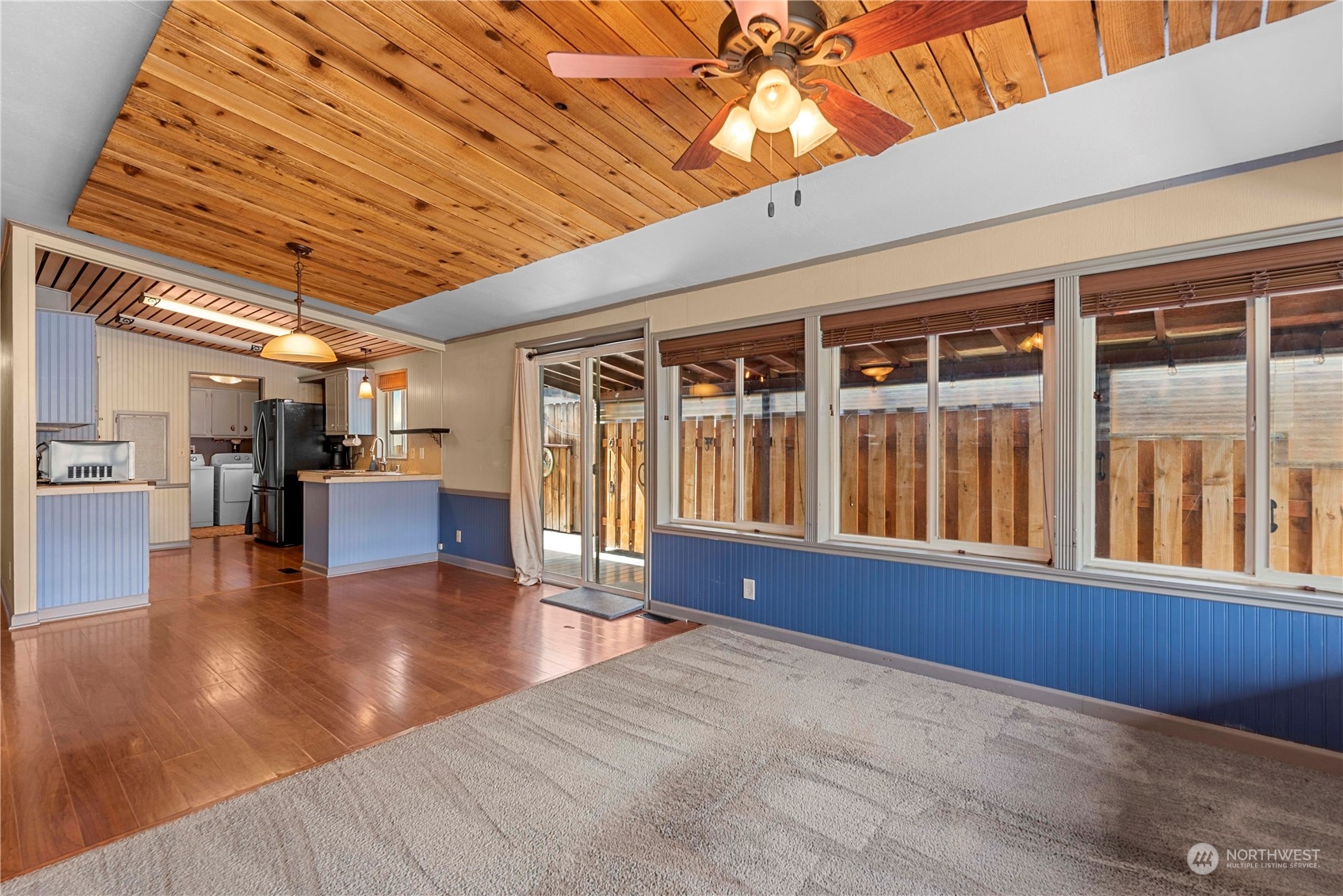 7900 Stine Hill Road, Unit 11 Cashmere, WA 98815 - Photo 13 of 39 a view of empty room with wooden floor and chandelier