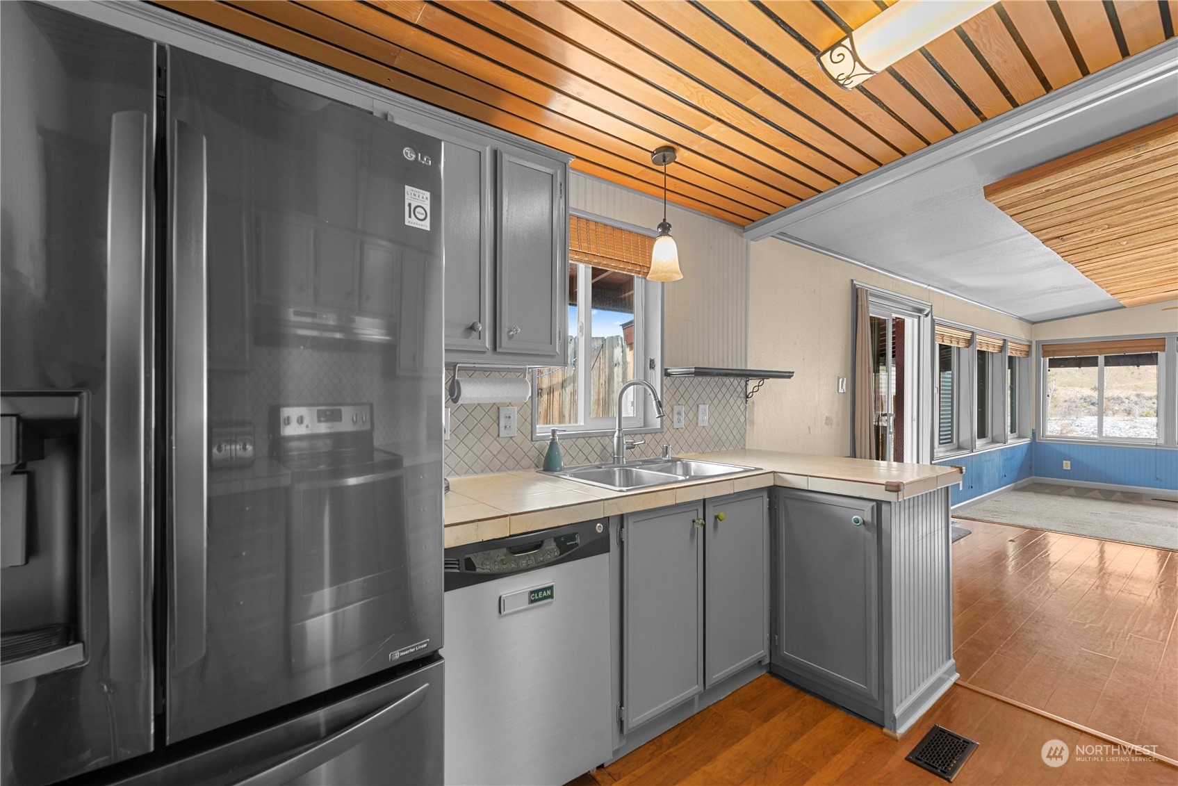 7900 Stine Hill Road, Unit 11 Cashmere, WA 98815 - Photo 16 of 39 a kitchen with a sink refrigerator and cabinets