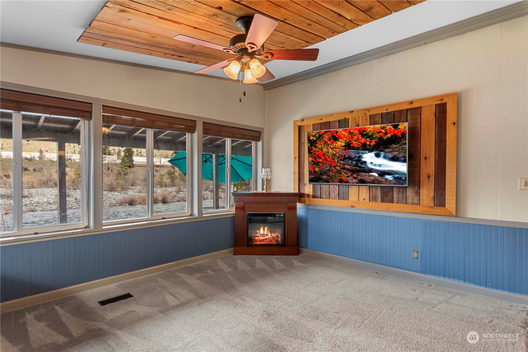 7900 Stine Hill Road, Unit 11 Cashmere, WA 98815 - Photo 10 of 39 a living room with fireplace furniture and a flat screen tv