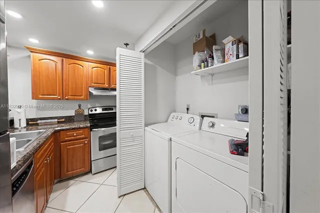 a kitchen with a sink cabinets and appliances