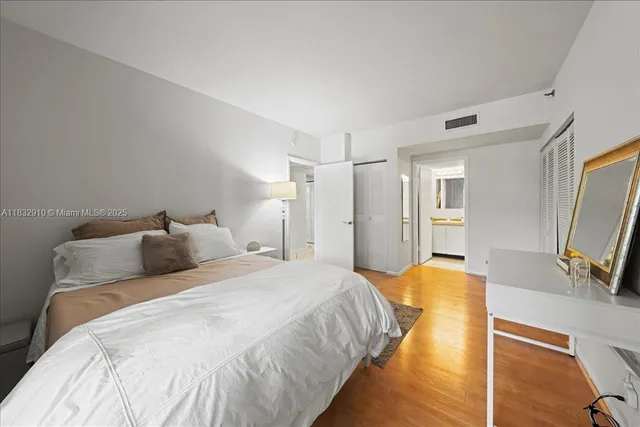 a bed room with a bed and a flat screen tv