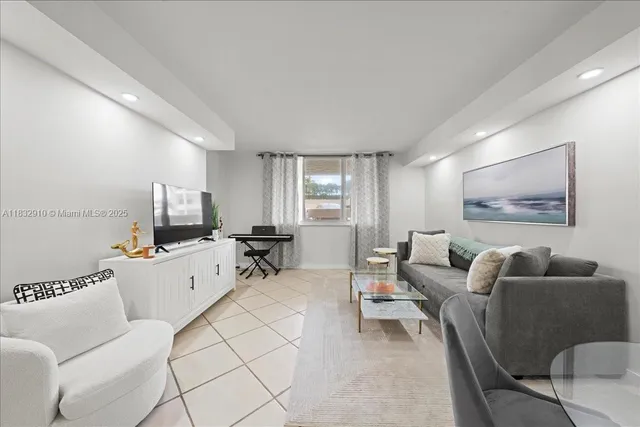 a room with furniture and a flat screen tv