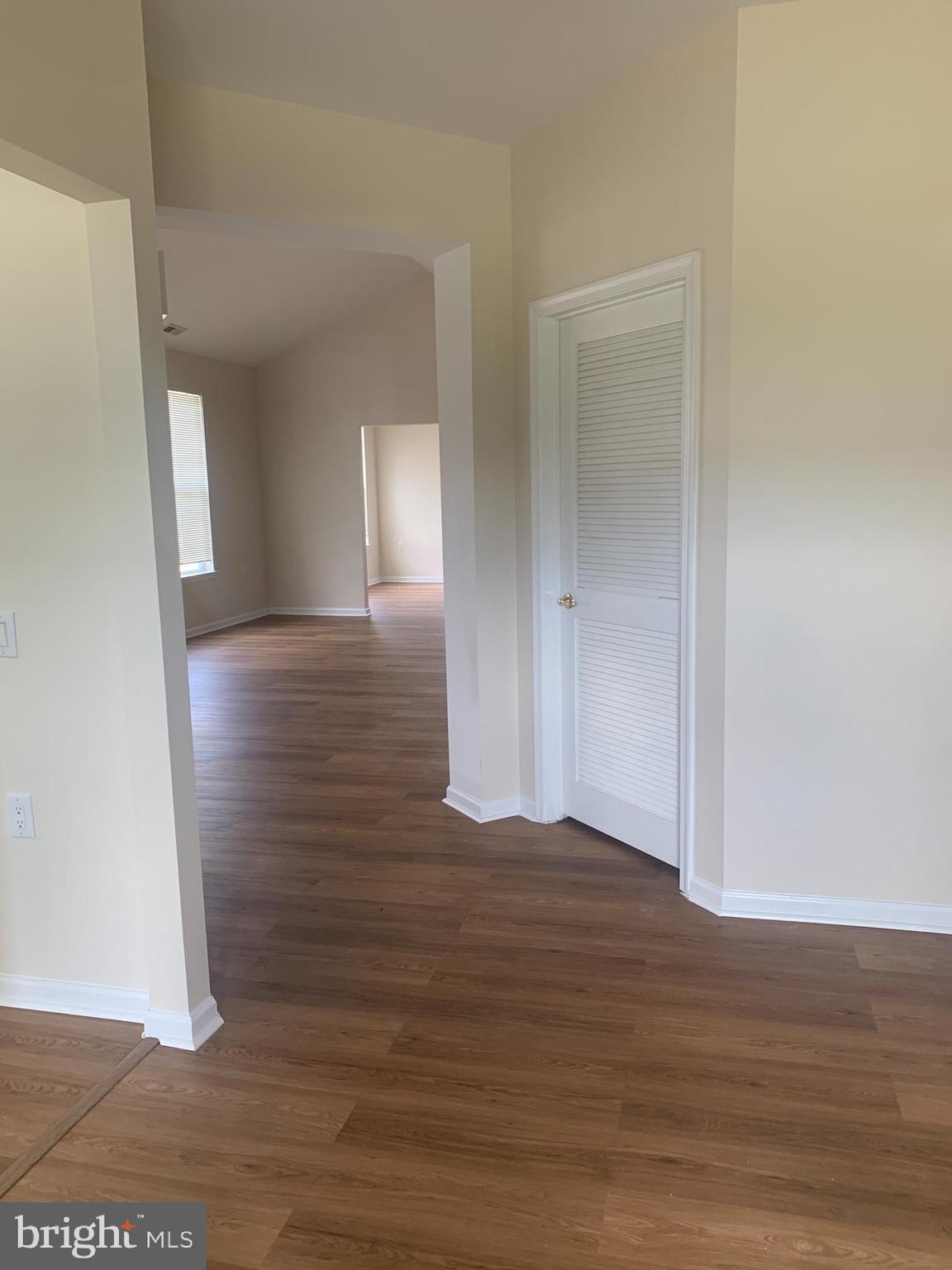 207 Devon Lane Hainesport, NJ 08036 - Photo 2 of 12 a view of a hallway with wooden floor