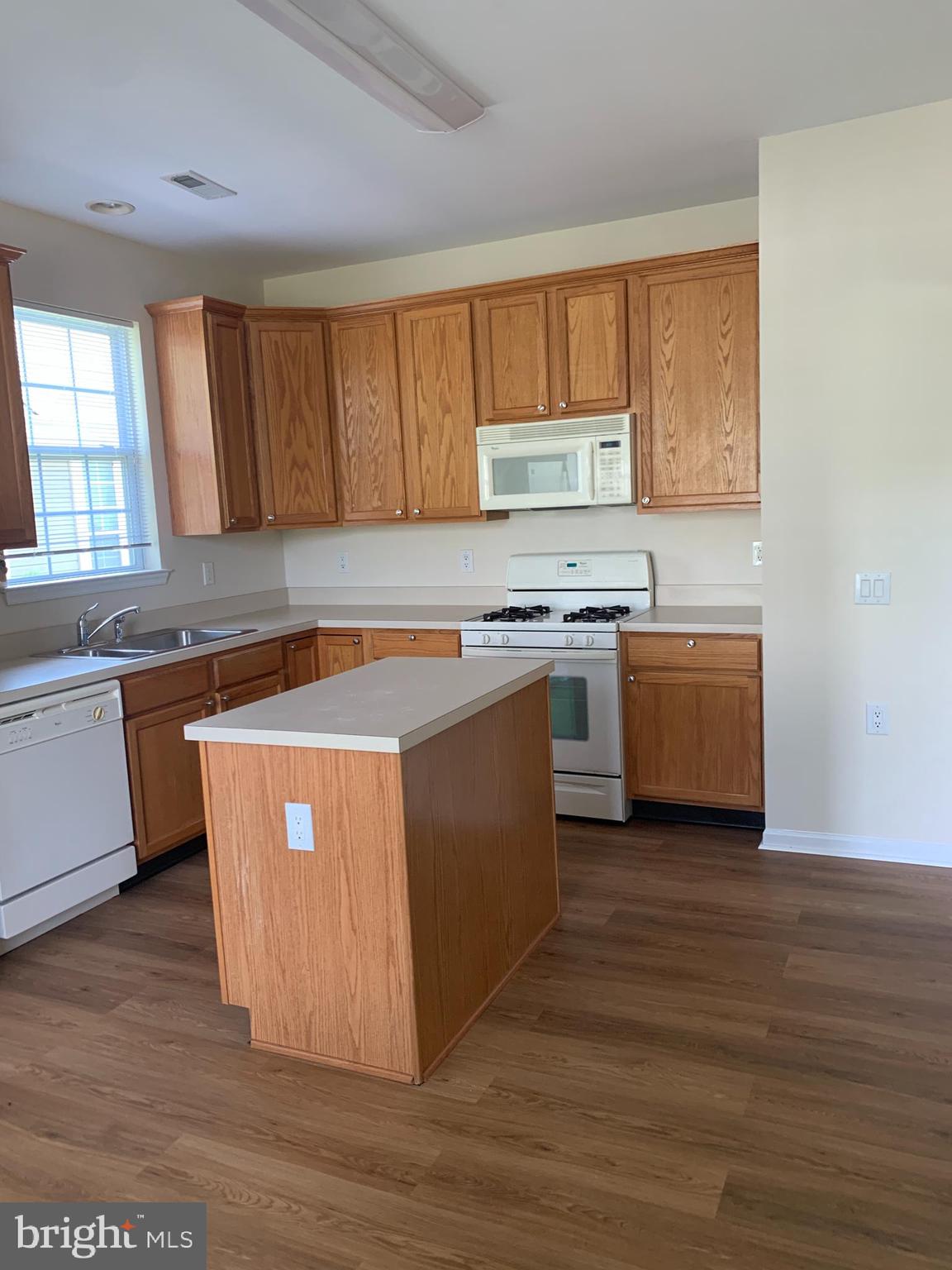207 Devon Lane Hainesport, NJ 08036 - Photo 5 of 12 a kitchen with stainless steel appliances granite countertop a stove a sink and a microwave