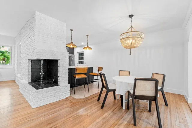a view of a dining room with furniture wooden floor and chandelier