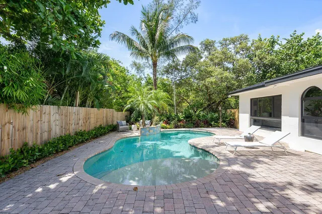 a backyard of a house with seating space