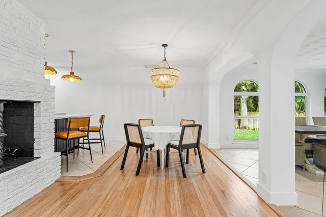 a view of a dining room with furniture wooden floor and chandelier