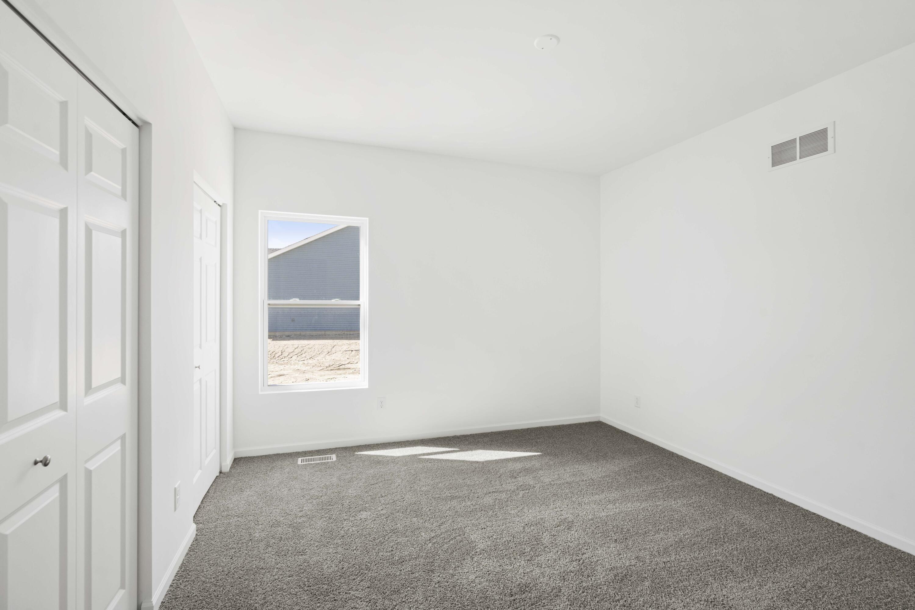 6561 East 103rd Avenue Crown Point, IN 46307 - Photo 4 of 11 an empty room with a window