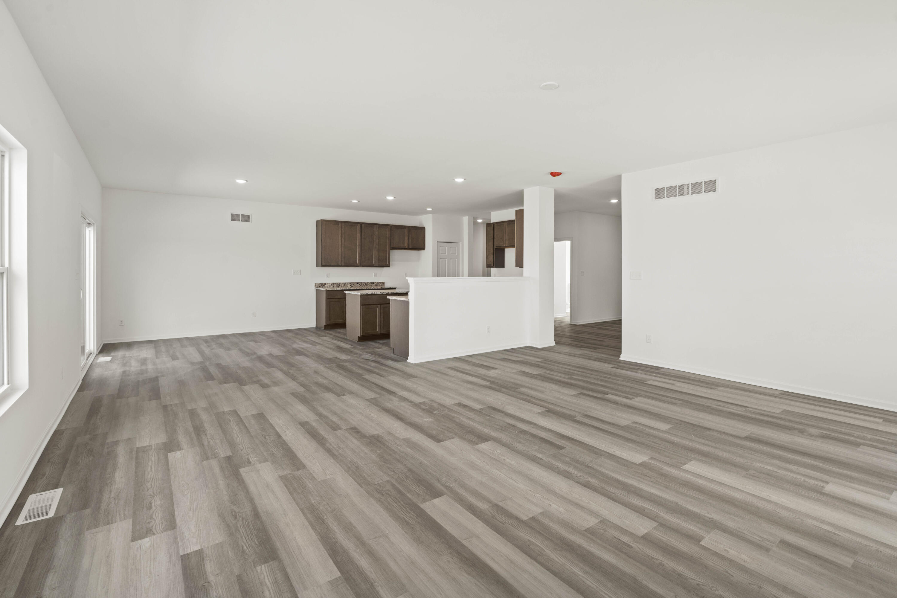 6561 East 103rd Avenue Crown Point, IN 46307 - Photo 6 of 11 a view of kitchen and wooden floor