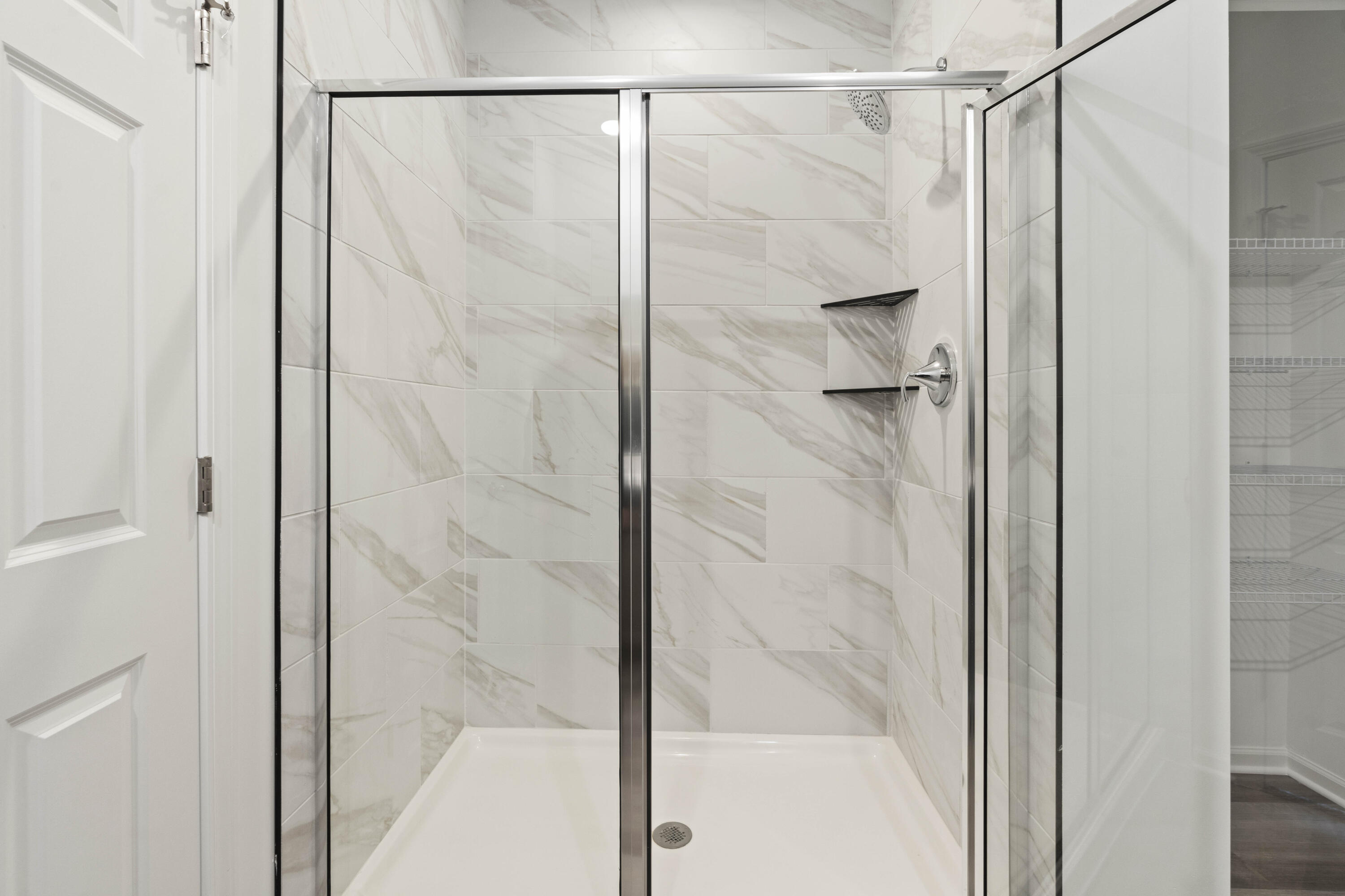 6561 East 103rd Avenue Crown Point, IN 46307 - Photo 9 of 11 a bathroom with a shower