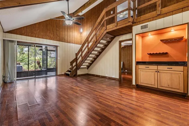 a view of an entryway with wooden floor