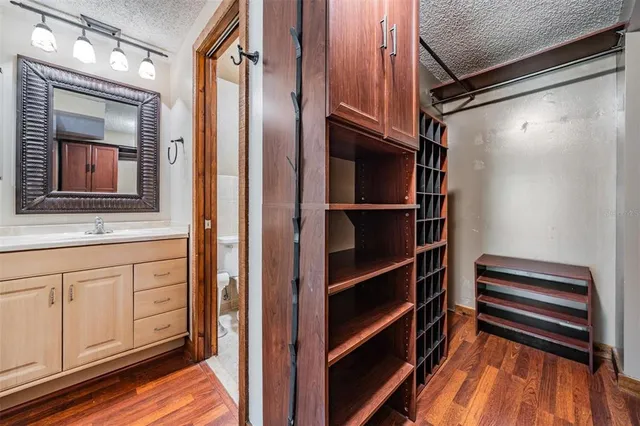 a view of walk in closet with empty racks