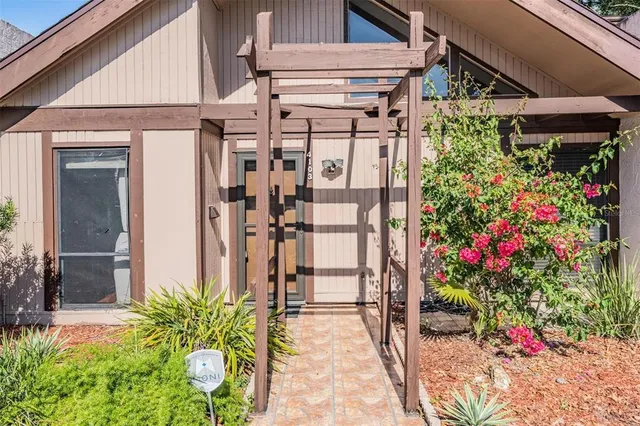 a view of a porch with potted plants