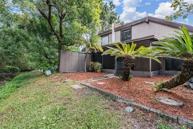 a view of a house with a yard and a garage