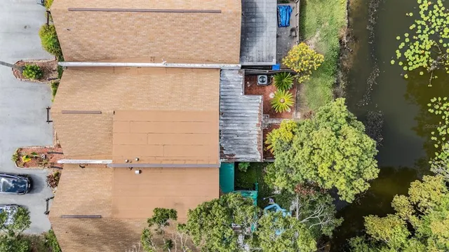 an aerial view of a house with a yard and garden