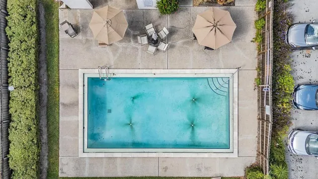 swimming pool view with a outdoor seating