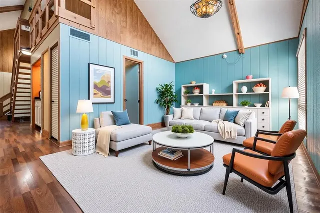 a living room with furniture and wooden floor