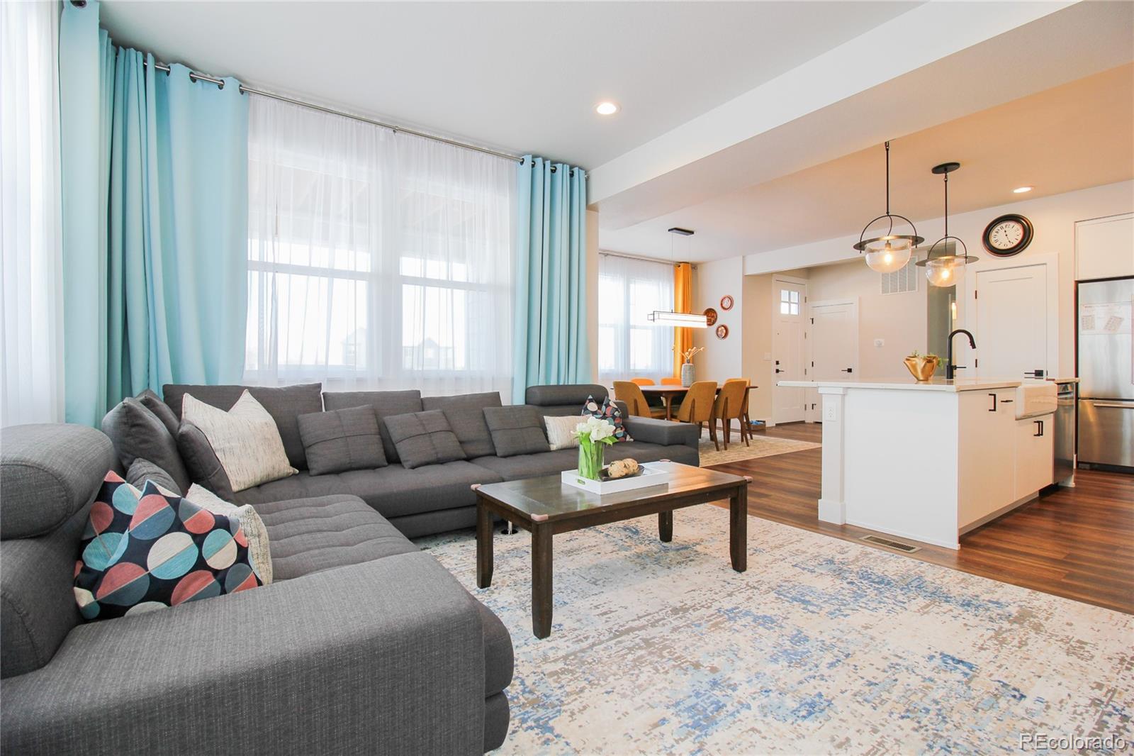 10394 Detroit Street Denver, CO 80229 - Photo 17 of 50 a living room with furniture and wooden floor