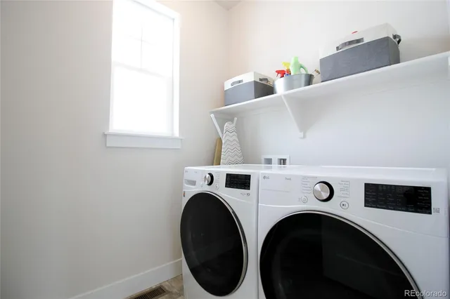 a utility room with dryer and washer