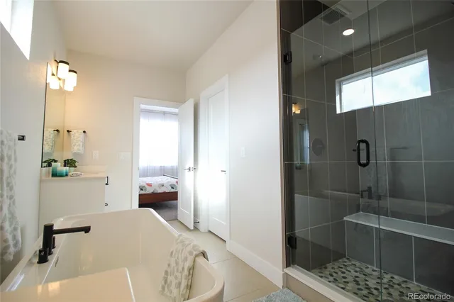 a bathroom with a bathtub and shower