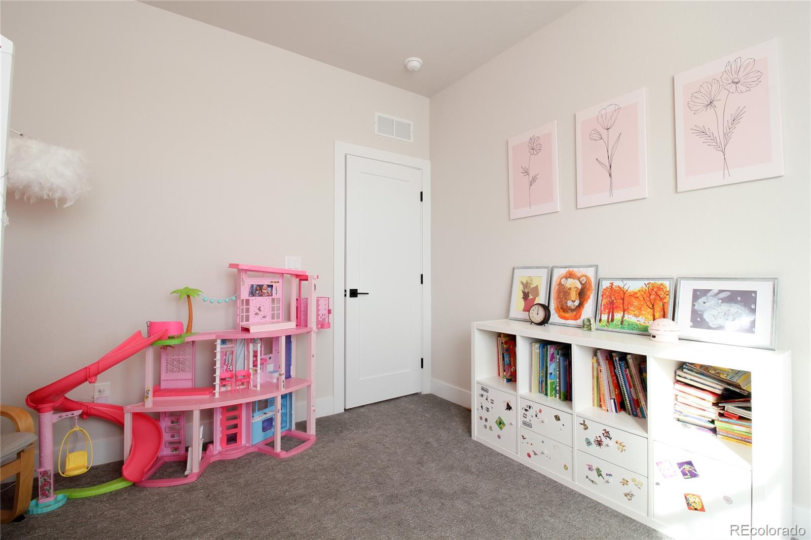 10394 Detroit Street Denver, CO 80229 - Photo 28 of 50 a room with toys and white cabinets