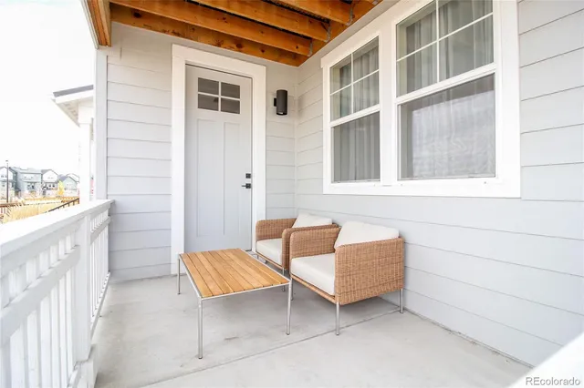 a backyard of a house with sofas