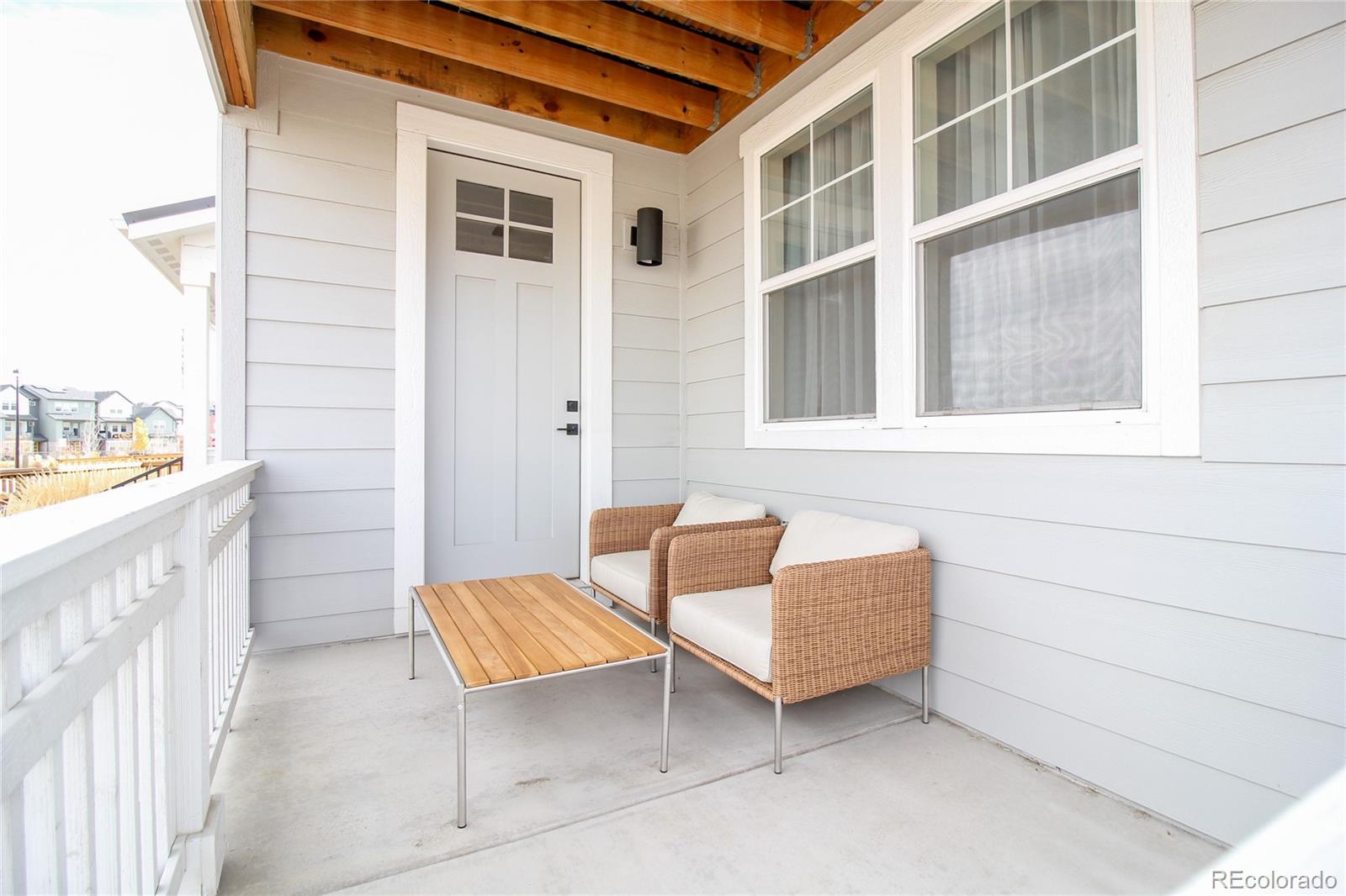 10394 Detroit Street Denver, CO 80229 - Photo 30 of 50 a backyard of a house with sofas