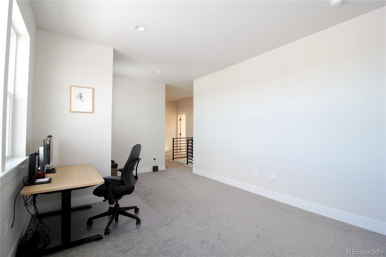 10394 Detroit Street Denver, CO 80229 - Photo 35 of 50 a view of a workspace with furniture