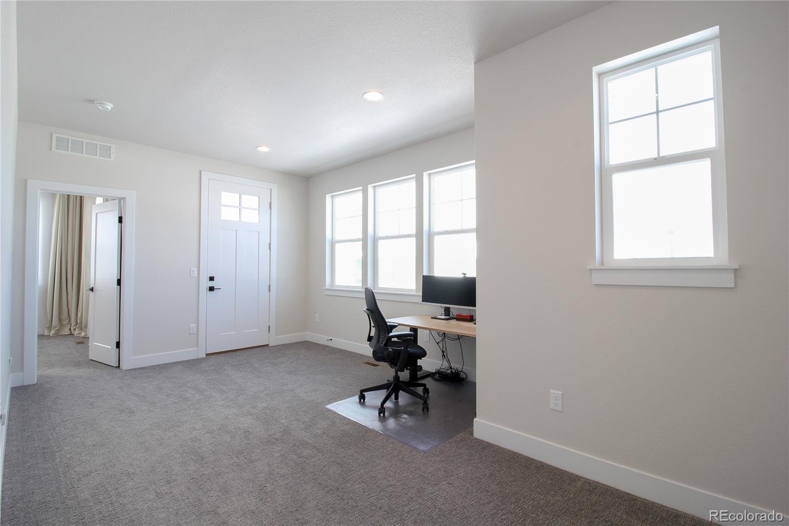 10394 Detroit Street Denver, CO 80229 - Photo 36 of 50 a view of a livingroom with a window