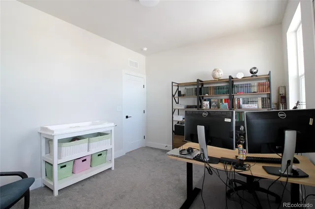 a room with furniture and musical instruments