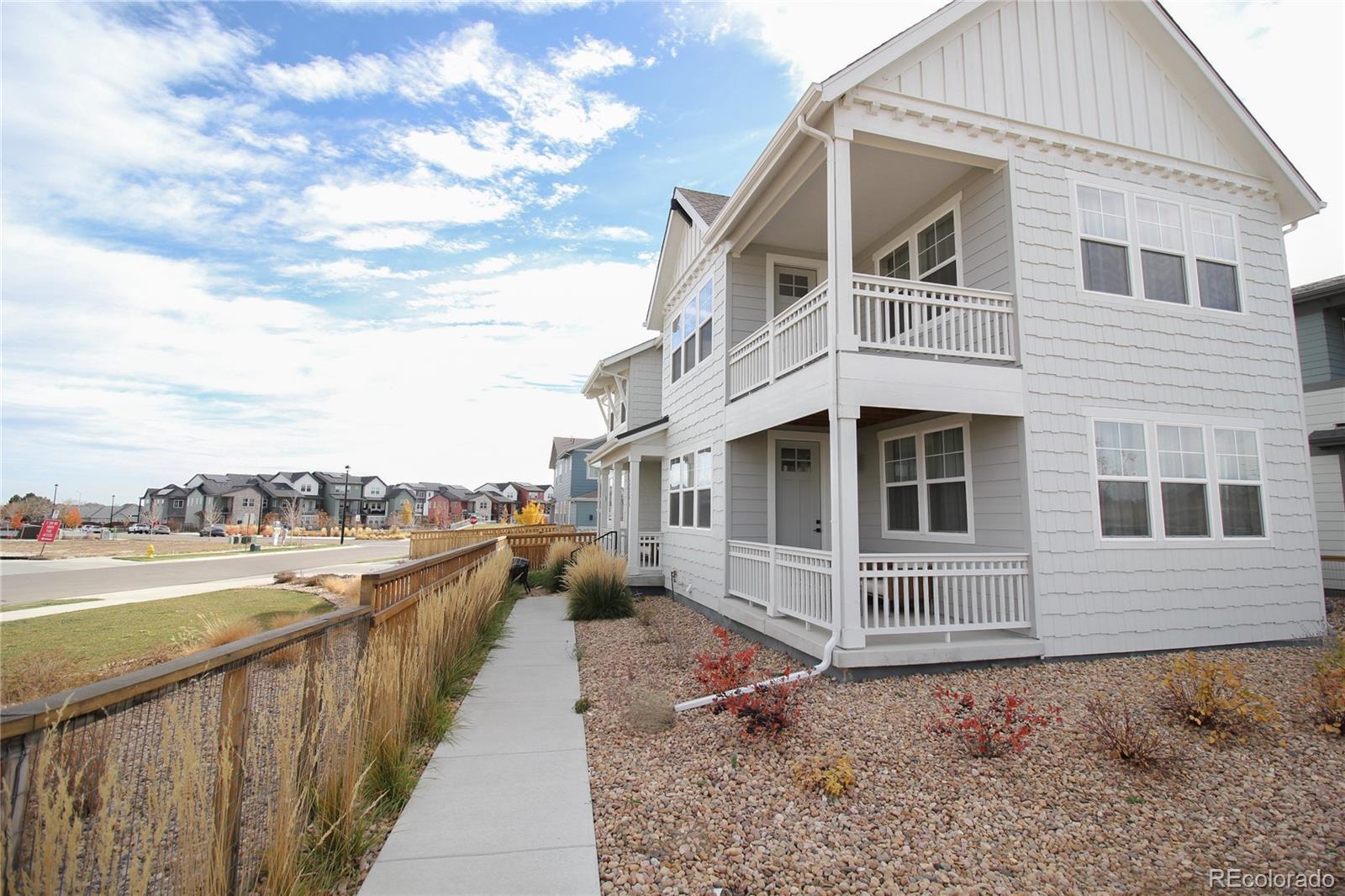 10394 Detroit Street Denver, CO 80229 - Photo 4 of 50 a view of a house with a yard