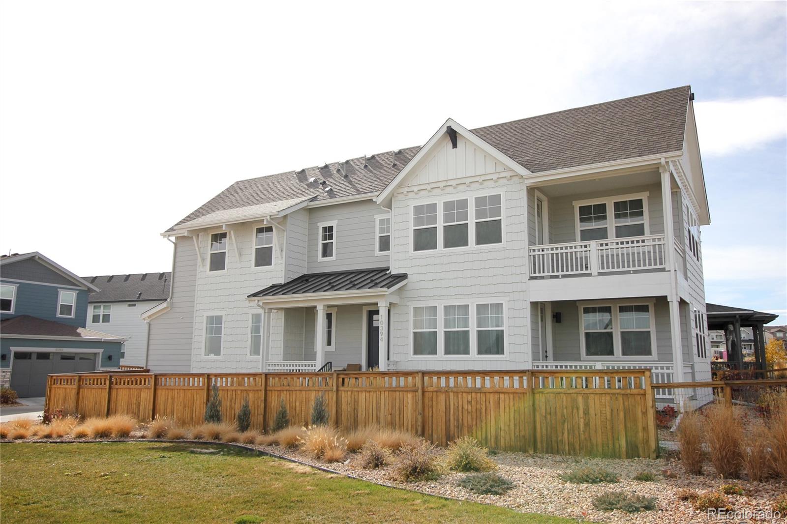 10394 Detroit Street Denver, CO 80229 - Photo 5 of 50 a front view of a house with a yard