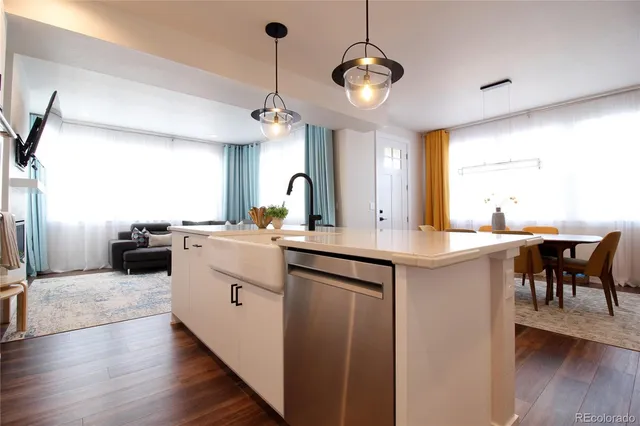 a kitchen with a sink cabinets and window
