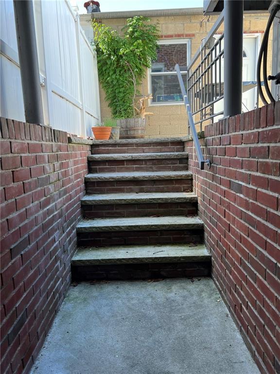83 Gravesend Neck Road Brooklyn, NY 11223 - Photo 8 of 27 a view of entryway with wooden floor and a front door